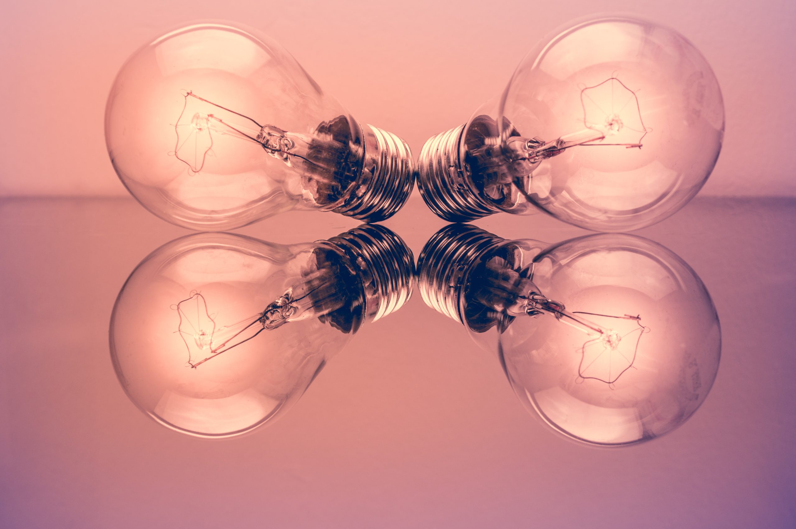 Four pink light bulbs
